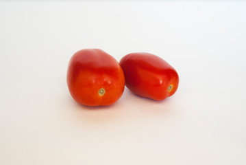 red tasty tomatoes on white background