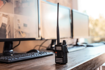 Modern portable transmitter and monitors with video broadcasting from CCTV cameras on table