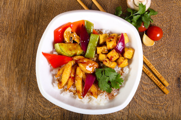 Wok with rice, cheese and tofu