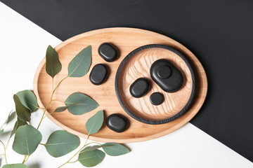 Flat lay composition with spa stones on color background