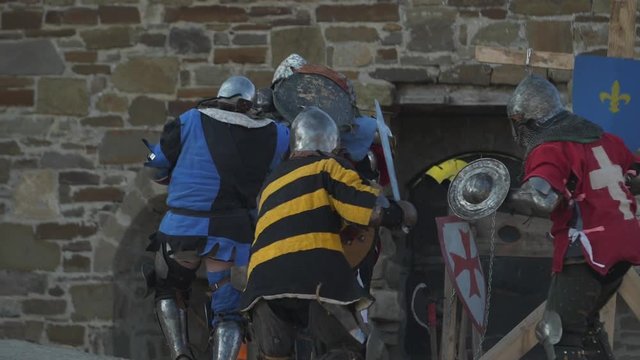 adult men play in the medieval war