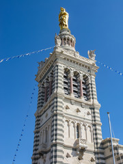 Fototapeta na wymiar Notre-Dame de la Garde (Our Lady of the Guard), a Catholic basilica and pilgrimage site in Marseille