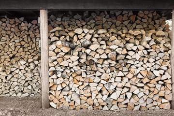 stacked firewood in wood shed woodpile stockpile
