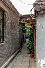The narrow alley of a traditional hutong in Beijing at sunrise - 5