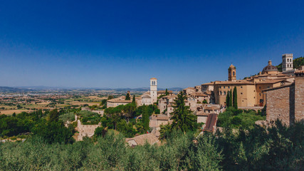 Fototapeta na wymiar Corridor of lower square of St Francis in Assisi, Italy, with landscape in the distance