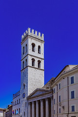 Fototapeta na wymiar Tower and entrance of Temple of Minerva in Assisi, Italy