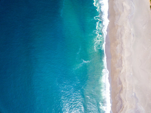 Aerial View Of The Ocean Waves Washing On The Coast Of The Pacific Ocean