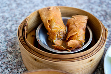 Dumplings made of flour placed in a wooden tray on the table.
