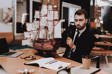 Sailboat. Magnifying Glass. Business. Workplace.