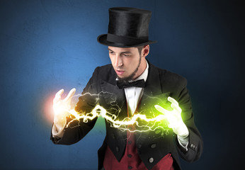 Magician sparkling super power between his two hands