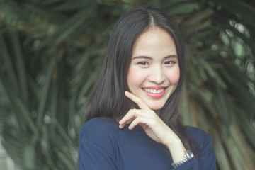 Portrait charming beautiful Asia woman at garden park nuture background.