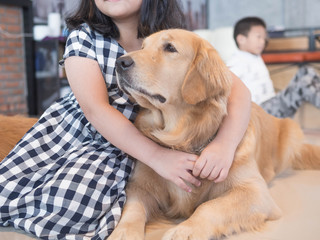 Portrait of Asian woman with dog.Gril playing with her dog in House.