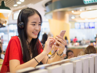 Young woman using a smartphone indoor.