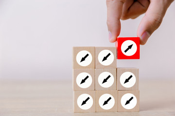 Hand picked red wooden blocks with white arrows facing opposite to the white arrows. With different...