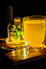 Ginger-mint tea with citruses in the cafe-restaurant to drink, relax well