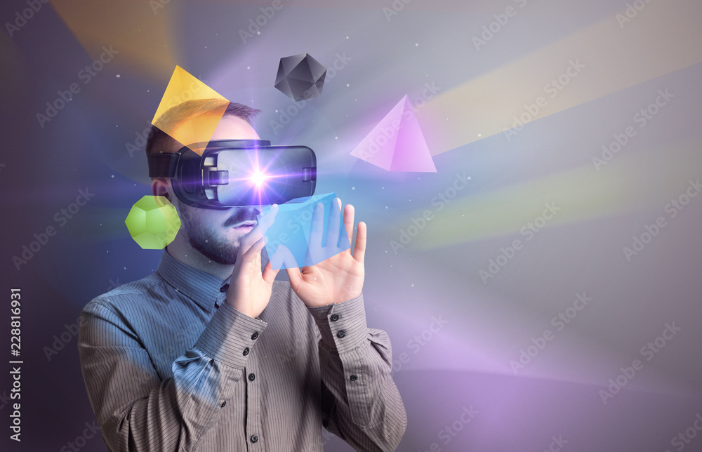 Poster amazed businessman with virtual reality colorful geometric shapes in front of him
