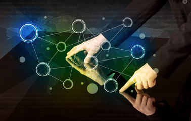 Male hands touching interactive table with colorful world map on it 