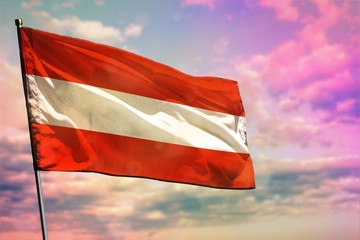 Fluttering Austria national flag on colorful cloudy sky background. Prosperity concept.