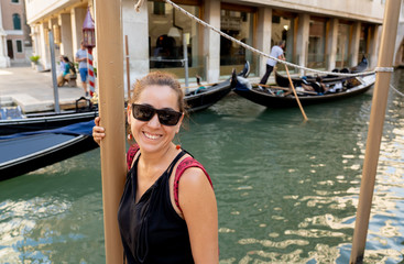 Fototapeta na wymiar Happy tourist visiting venice city and having fun in Italy