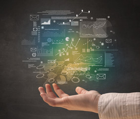 Demographic related charts, diagrams and graphs hovering over young hand