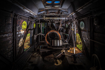 Interior of partially dismantled engine of old diesel locomotive, urbex