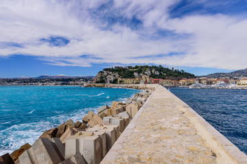 The breakwater in the port of Nice, beautiful view of the Mediterranean sea and cityscape of Nice, Cote d'azur, France.