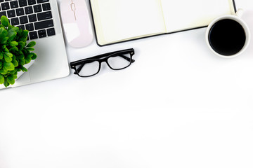 Workspace in office ,White desk with blank notebook and other office supplies,Top view with copy space.