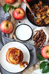 Pancakes with caramelized apples and cup of milk