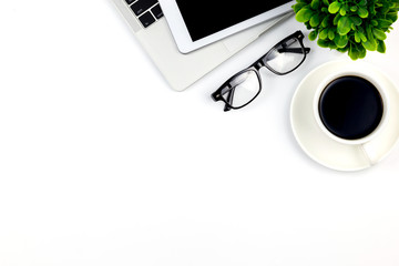 Top view of Office desk with workspace in office with blank notebook tablet and smartphone with other office supplies,with copy space.