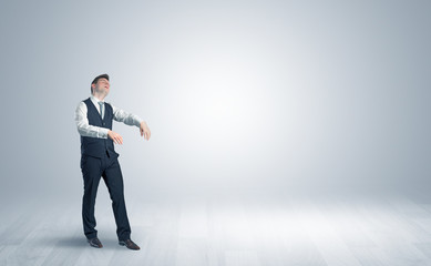 Zombi, sleepy maniac businessman walking in a copy space

