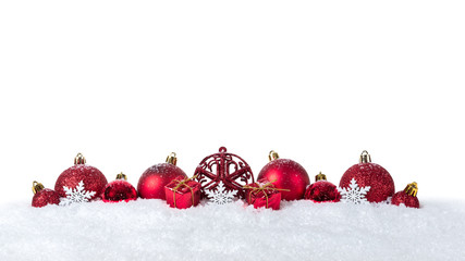 Christmas background with decorations and christmas balls on snow isolated on white background