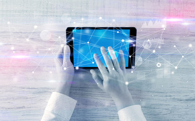 Hand using tablet with linking graphs charts  report and informational flow concept
