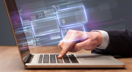 Hand typing on laptop with online accounting system concept
