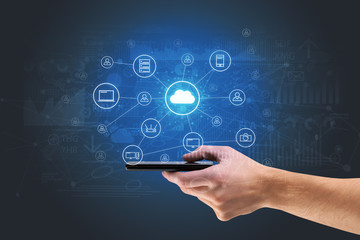 Businessman working on phone with reports and graphs concept around
