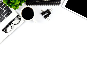Top view of Office desk with workspace in office with blank notebook tablet and smartphone with other office supplies,with copy space.