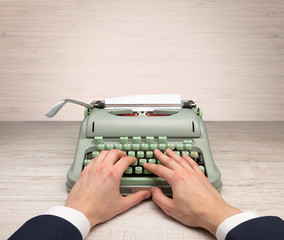First person perspective elegant hand writing on an oldschool typewriter with copyspace

