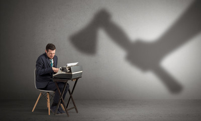Shadow threatening hard worker man who is afraid
