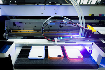 Digital uv printer laser machine for print your smart phone business. - obrazy, fototapety, plakaty