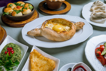 Georgian cuisine foodset from khachapuri, khinkali, pkhali, dolma, satsivi top view