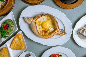 Georgian cuisine foodset from khachapuri, khinkali, pkhali, dolma, satsivi top view
