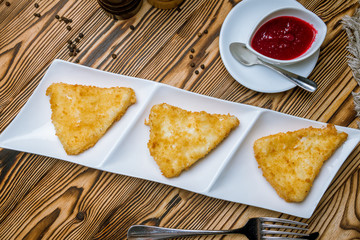 deep fried cheese with berry sauce
