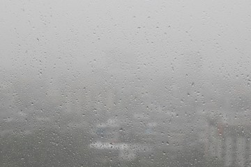 Rain water drops on blue background