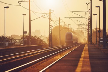 Fototapeta na wymiar Passenger train at sunrise.