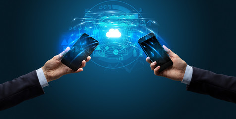 Two mobile phones syncing through the cloud