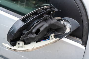 Broken and damaged wing mirror plastic cover