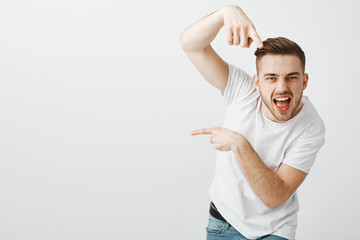 You go there. Portrait of stylish confident and emotive macho man with bristle and stylish haircut...