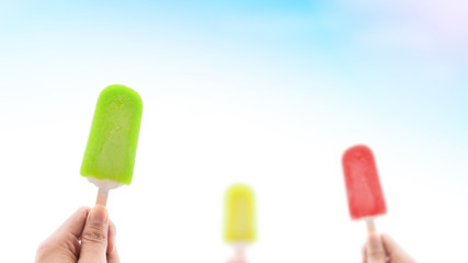 Colorful ice cream in summer background concept. Happy vacation time on the beach in creative style.