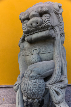 Stone sculpture of a male chinese guardian lion (Shanghai, China)