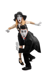 Two mimes acting like spies
