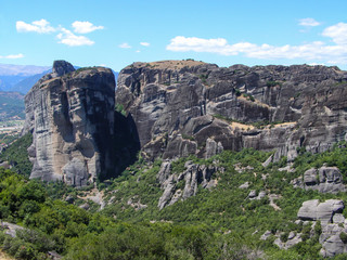 Colorful natural European landscape. Mountain range with green trees.